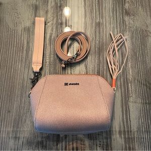 Sherpani new without tags. Cute clutch or crossbody.